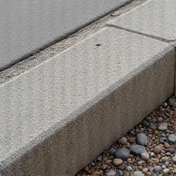 Close-up of exposed aggregate concrete kerb